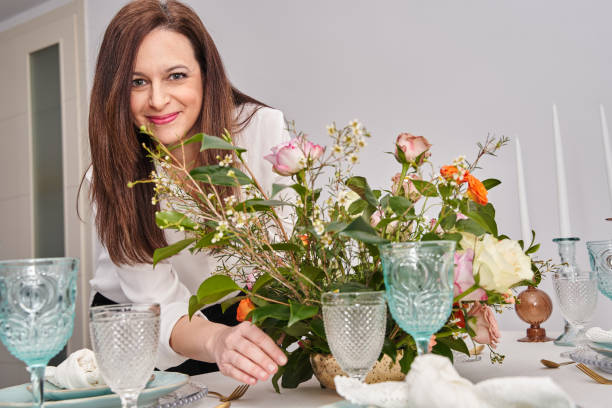 istock woman setting the table for a romantic meal 1503026676
