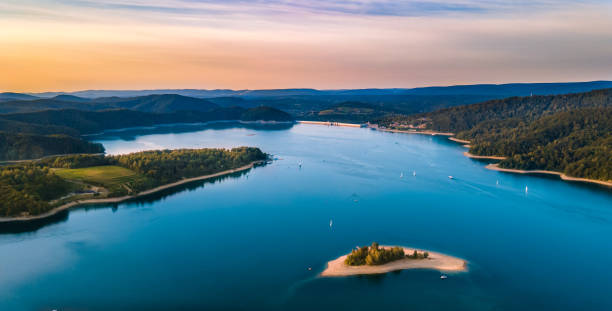 Solina Lake at sunset in Poland, Bieszczady Dam in Solina at sunset with Hare Island in Bieszczady bieszczady mountains stock pictures, royalty-free photos & images