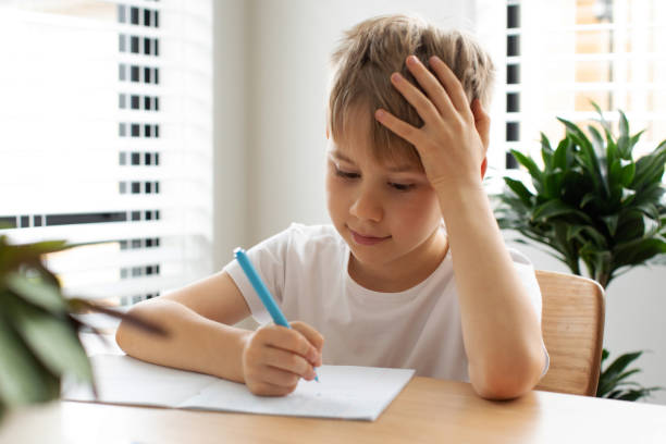 istock Cute boy doing school homework at home. Distance education. Online education. 1503035685