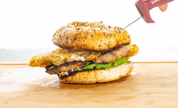 istock Breakfast sandwich everything bagel with pork egg and avocado 1503044767