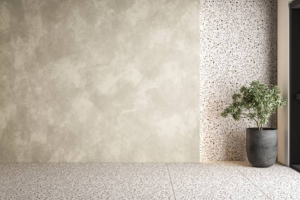 istock A spacious and airy interior with concrete and terrazzo walls, terrazzo flooring, a large window, and an inviting seating area. Perfect for home decor mock-ups. 3d rendering 1503056514