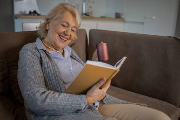 istock Woman relaxing and reading a book 1503060346