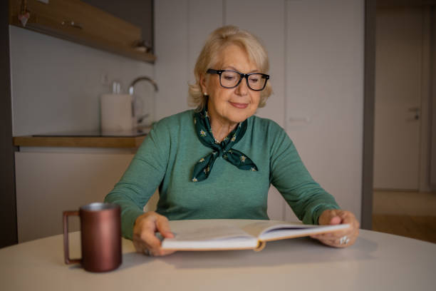 istock Woman relaxing and reading a book 1503060352