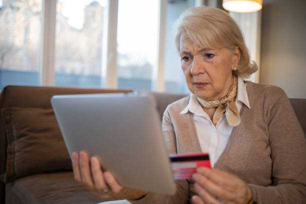 istock Cheerful  woman doing online shopping 1503060356