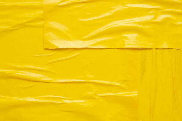 istock Blank yellow crumpled and creased paper poster texture background 1503060502