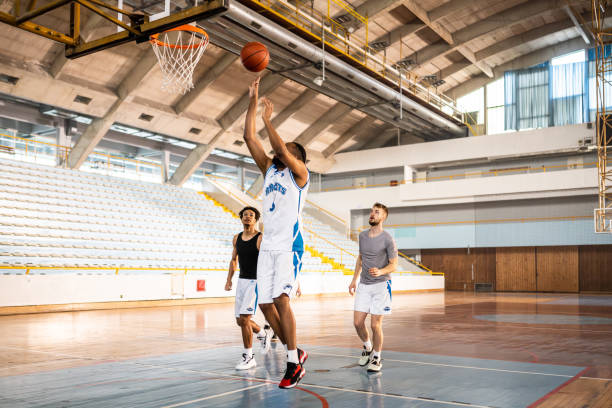 istock Basketball male team throwing ball into hoop 1503060542