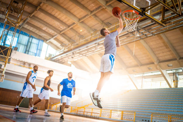 istock Basketball male team throwing ball into hoop 1503060548