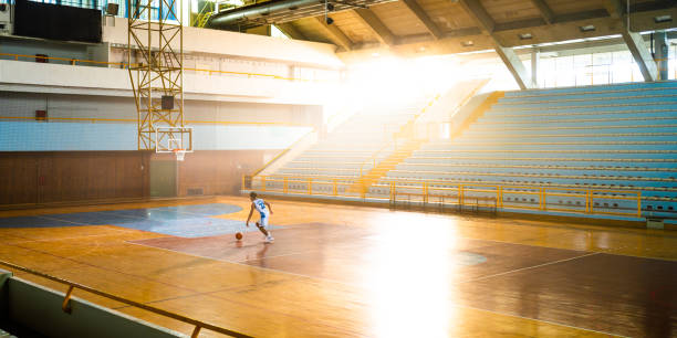 istock Basketball player dribbling ball at court 1503060593