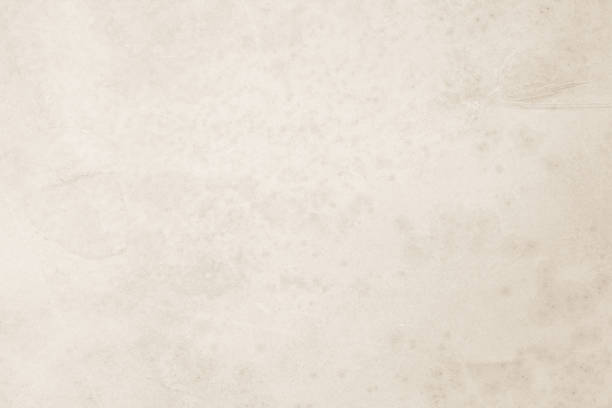 istock Colour old concrete wall texture background. Close Up retro plain cream color cement wall background texture. Design paper vintage parchment element show or advertise or promote product on display. 1503060661