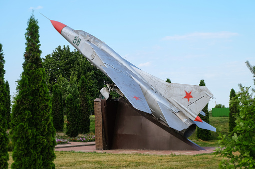 Vyshnee Bolshoye village, Volovskiy district, Lipetsk region, Russia - July 15, 2022: Soviet fighter aircraft MIG - 23 on the pedestal. Monument to the pilot hero of the Soviet Union Soldatov Ivan Alekseevich.