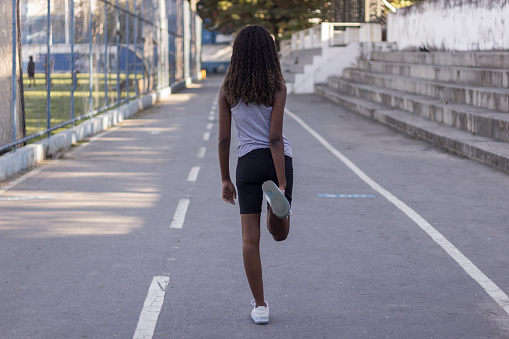 Sporty young teenager getting ready to run training