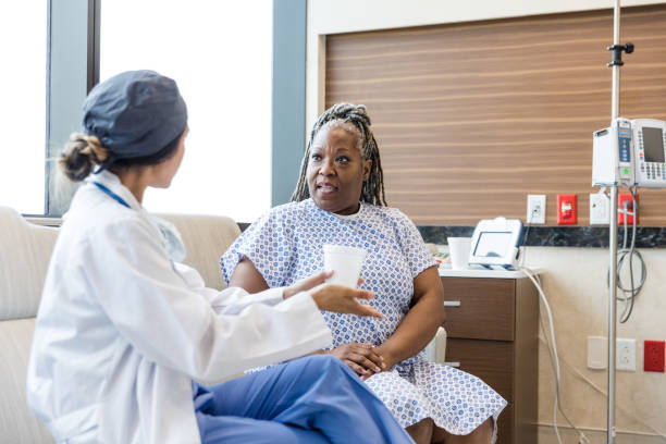 istock Mature female patient listens as surgeon discusses procedure 1503065252