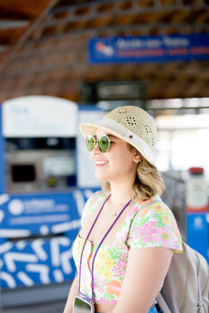 istock Happy young woman at train station 1503067890
