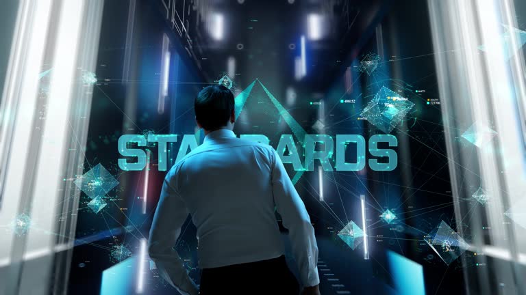 Standards. Man in Futuristic Office Interior Moving and Activating Hologram.