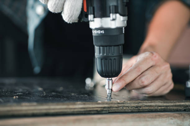 istock Close up asian man hand holding electric cordless screwdriver machine 1503101896