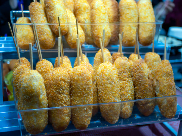 istock Homemade fried breaded Corn Dogs in a plastic container 1503128062