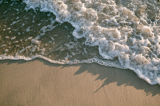 Close up shot of waves at the beach in Carlsbad, California, United States