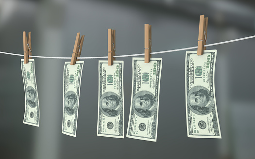 Money laundering - drying dollar bills on clothes line