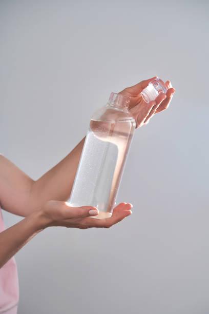 istock Bottle with drinking water in female hands. 1503168256