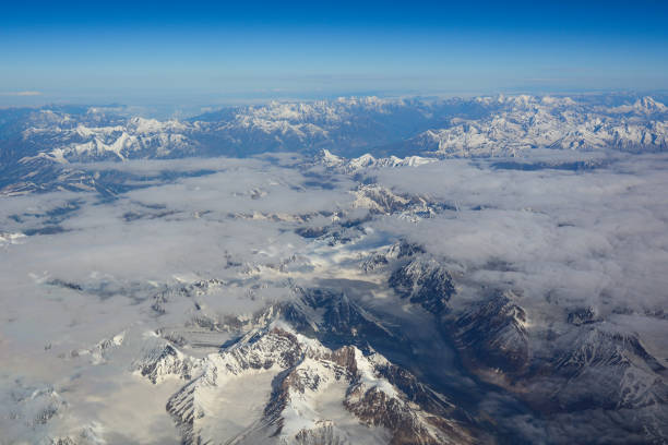 istock Aerial view above snow mountain peaks 1503168267