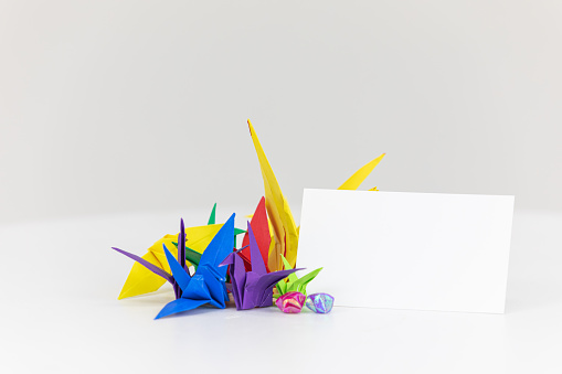 Blank white business cards on a white background. mockup, colorful paper cranes