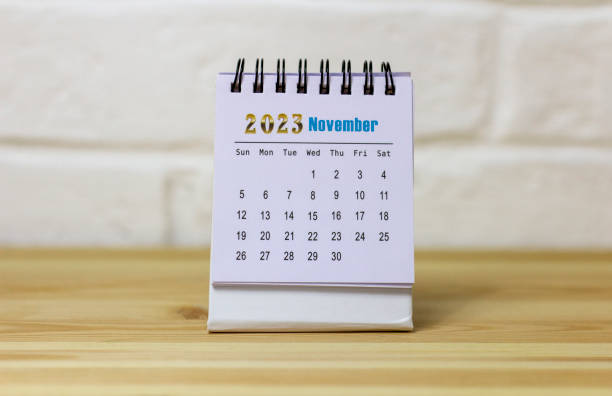 istock Desktop calendar for November 2023 on a wooden table. 1503204631