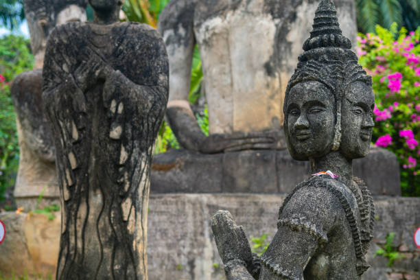 views of famous buddha park in vientiane, laos vientiane, laos. 31th may 2023: views of many sculpture of buddha park. it contains over 200 Hindu and Buddhist statues vientian stock pictures, royalty-free photos & images