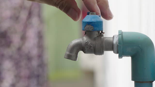 4k Closeup shot of Hand closing water tap