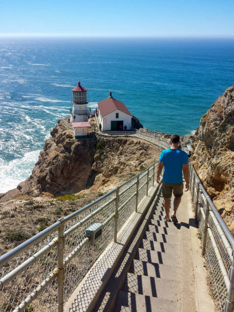 istock Man walking down steps to Point Reyes Lighthouse in Northern California 1503209667