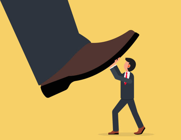 istock Unfair competition, Conflict or employee fight concept. Small businessmen trying to push back giant boss or competitor big feet. 1503209694