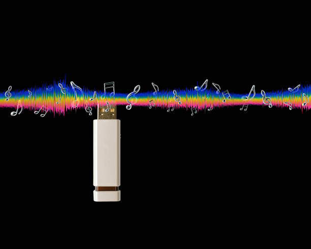 Close-up of music USB flash storage with sound equalizer wave line and flying musical notes against black background