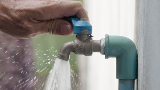 4k Closeup shot of Hand closing water tap