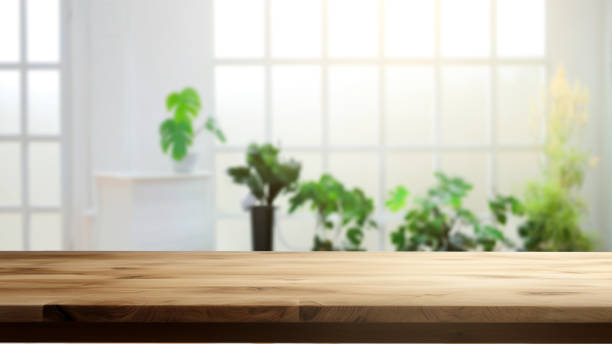istock Empty wooden table on blurred living room background 1503213094