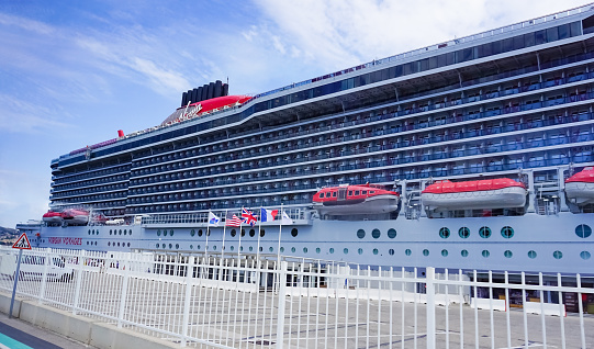 Liverpool, England, UK - September 18, 2021:  Queen Elizabeth II (QE2) moored at the Liverpool Cruise Terminal on the city's waterfront.  Built to a design of John Gardner, it was constructed at Clydebank (Glasgow) and launched in 1967.