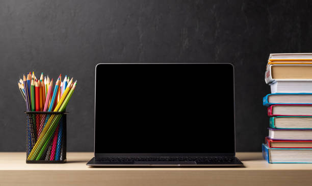 istock Laptop, books and pencils on desk 1503214342