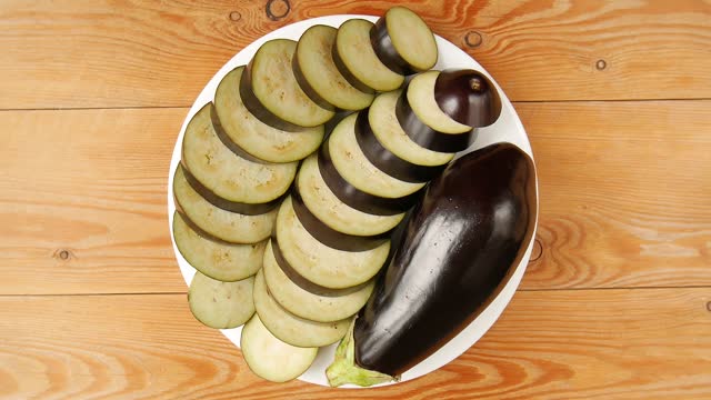 Sliced eggplant on a plate.