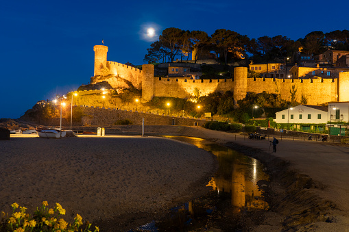 Tossa de Mar town at Costa Brava, Gerona Catalunya Catalonia, Spain on September 2020. Night view of ancient fortress and old town by the Mediterranean sea.