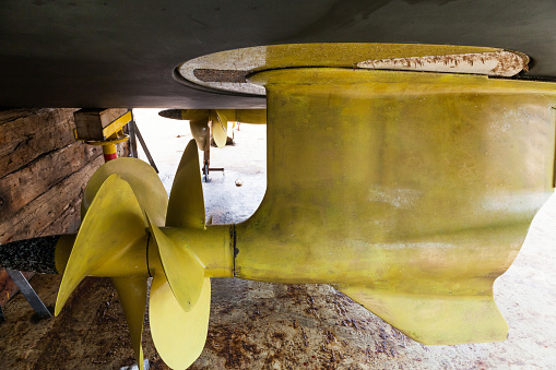 Bronze propellers on an expensive yacht. Two azimuth engines at the stern of the yacht. Double row of propellers.