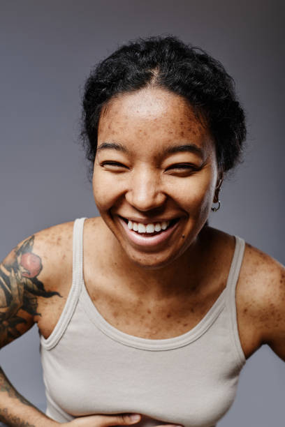 Black woman laughing with candid emotion