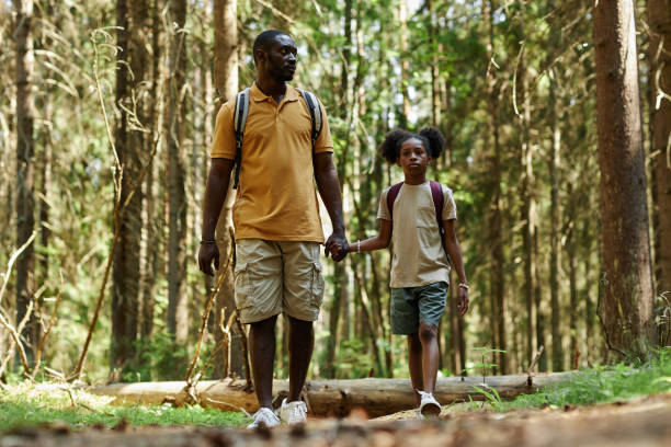 istock Dad hiking in the forest with his daughter 1503225239