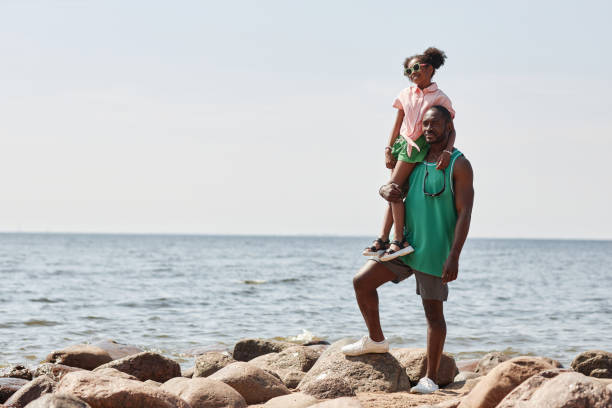 istock Dad with his little daughter on the beach 1503225285