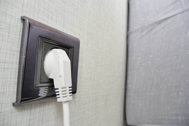 istock white color power cord cable plugged into wall 1503226326