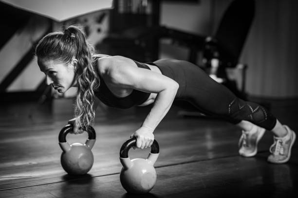 istock Woman Doing Push-ups with kettlebells 1503228099