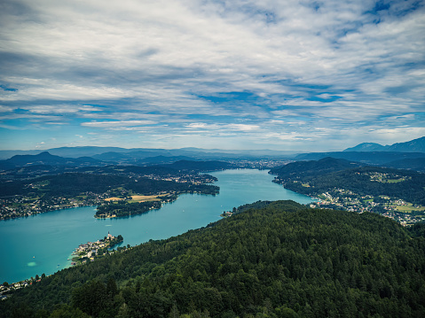 Aerial view of Worthersee (Wörthersee) and Klagenfurt in Carinthia, Austria, from the Pyramidenkogel lookout tower in the summer cloudy weather