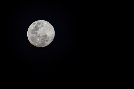 Full moon isolated on black night sky background