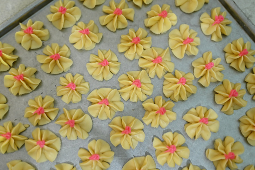 The process of making flower-shaped Eid cakes made from flour in Aceh, Indonesia