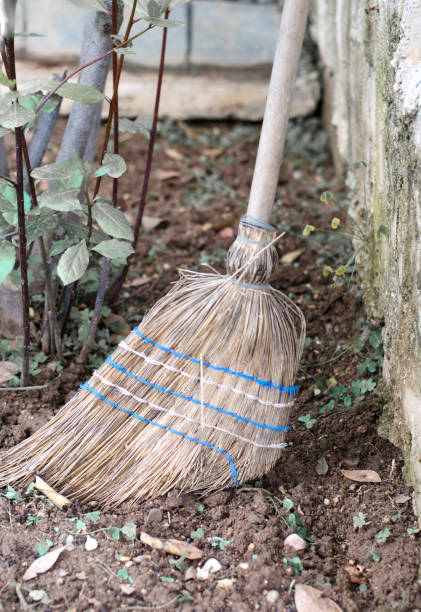 Old straw broom in the garden