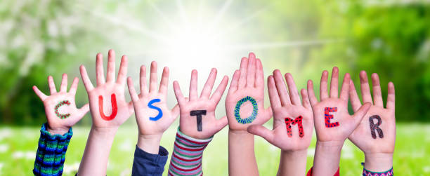 istock Children Hands Building Word Customer, Grass Meadow 1503234289