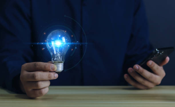 istock Light bulb idea in the hands of a businessman. 1503236289
