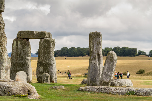 Stonehenge - Cornwall (UK) - Stonehenge is a prehistoric monument on Salisbury Plain in Wiltshire, England, two miles (3 km) west of Amesbury. It consists of an outer ring of vertical sarsen standing stones, each around 13 feet (4.0 m) high, seven feet (2.1 m) wide, and weighing around 25 tons, topped by connecting horizontal lintel stones. Inside is a ring of smaller bluestones.